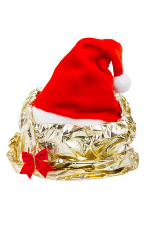 Santa Claus red hat in gift wrapping paper of gold colorの写真素材