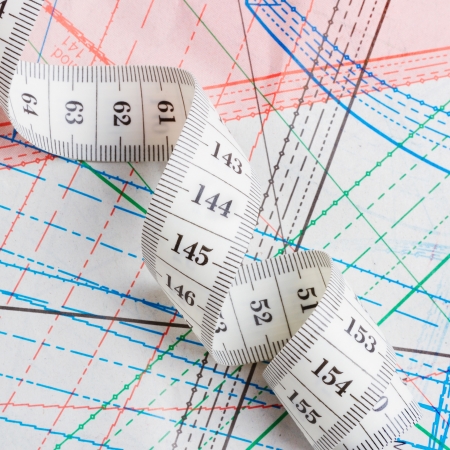 Dressmaker or tailor professional equipment  measuring tape and  patterns of clothingの写真素材