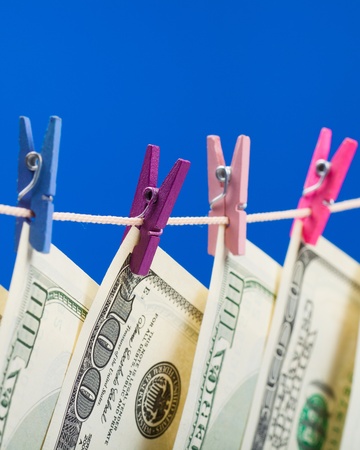 Hundred dollars hanging on a clothesline  Money laundering conceptの写真素材