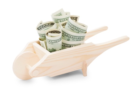 wooden Wheelbarrow with dollarsの写真素材