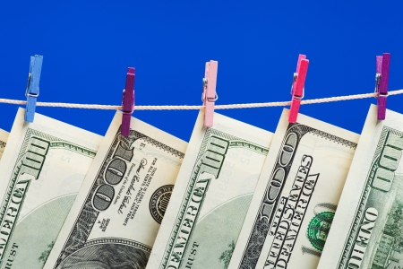 Hundred dollars hanging on a clothesline  Money laundering conceptの写真素材