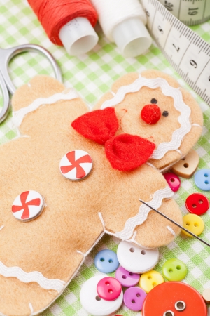 Sewing set and handmade gingerbread man from textile の写真素材