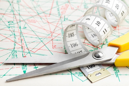 scissors and measuring tape on sewing pattern