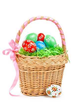 easter eggs in basket on whiteの写真素材