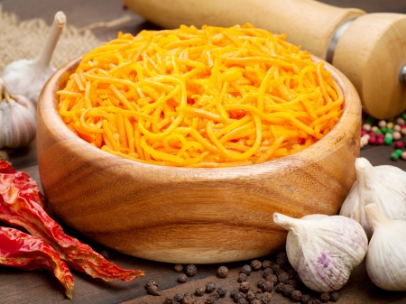 carrot cut in julienne, salad in wooden bowlの写真素材