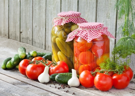 canned tomatoes and pickled cucumbers, homemade preserved vegetablesの写真素材
