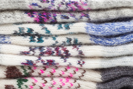 Pile of wool clothing, winter background