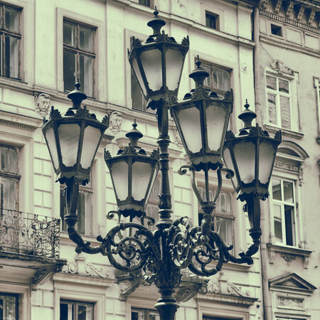 Vintage stylized photo of Street light against building facadeの写真素材