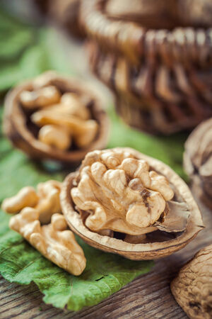 Walnut close up, basket on background, selective focusの写真素材