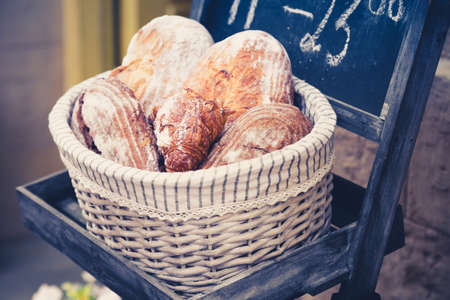Wholemeal bread in a basket in the bakery.の写真素材