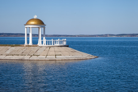 Classic style gazebo with column on shoreの写真素材
