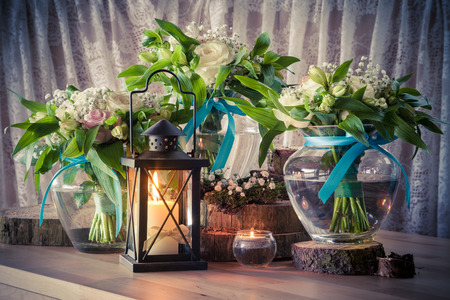 Still life with three wedding bouquets and candles, vintage stylized.の写真素材