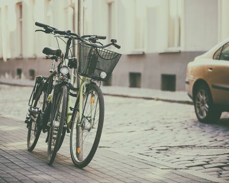 Two bicycles on street. Selective focus.の写真素材