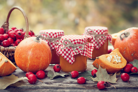 Pumpkin jam, puree or sauce and hawthorn berries. Autumn still life. Selective focus.の写真素材