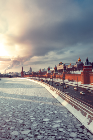 View of Kremlin, winter Moscow river and  driveway on waterfront at sunsetの写真素材
