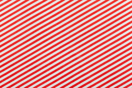 Red and white diagonal fabric striped patternの写真素材