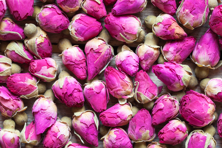 Dry rose buds tea background. Top view.の写真素材