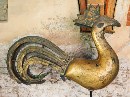 Riga, Latvia - 25-August-2015: old bronze Chicken weathercock inside the Riga Cathedral. Riga, Latvia.のeditorial素材