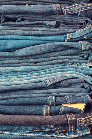 Stacked fashion blue jeans closeupの写真素材