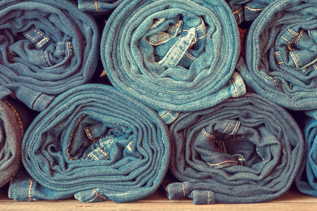 Rolled jeans background, retro toned.の写真素材