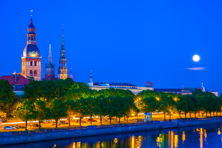 Old Town of Riga with reflection in Daugava River at night. Riga, Latviaの写真素材