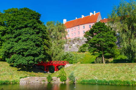 Old park with Snelli pond and view of Toompea hill in center of Tallinn. Estonia.のeditorial素材