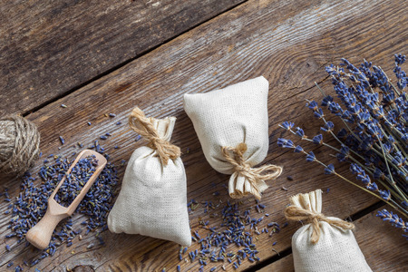 Bunch of lavender flowers and sachets filled with dried lavender. Top view. Flat lay.の写真素材