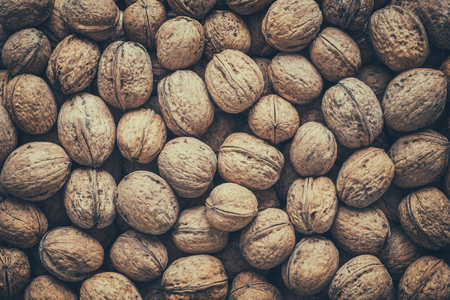 Walnuts, top view. Retro toned photo.の写真素材