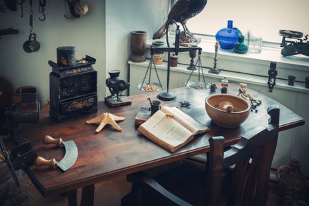 Grodno, Belarus - April 5, 2017: apothecary table with drugs and vintage equipment in the pharmacy museum of Grodno city. Grodno, Belarus.のeditorial素材