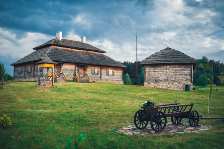 Retro ethnic houses on rural landscape - village of birthplace of Tadeusz Kosciuszko - Kossovo, Brest region, Belarus.の写真素材