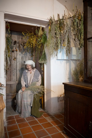 Kaunas, Lithuania - May 12, 2017: Mannequin of senior herbalist woman in Museum of the History of Medicine and Pharmacy. Kaunas, Lithuania.のeditorial素材