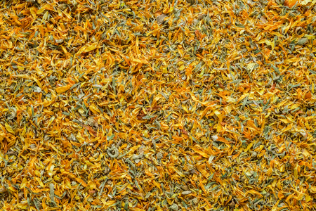 Background of dry calendula flowers, dried marigold petals. Top view.の写真素材