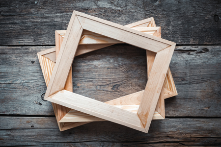 Wooden stretcher bars on dark wooden background. Top view.の写真素材