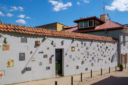 Vilnius, Lithuania - May 14, 2017: Literatu Street -  oldest streets in the Old Town of Vilnius, Lithuania. The walls of the street are decorated with dedications to writers, poets, translators, literary groups and publications.のeditorial素材