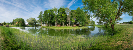 Summer cafe gazebos on shore of pond in park of Kossovo village near Tadeusz Kosciuszko house, Brest region, Belarus.の写真素材