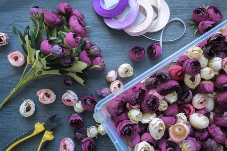 Making a artificial flower bouquet for wedding decorating and interiors. Tools and accessories for creating on table, top view, flat lay.の写真素材