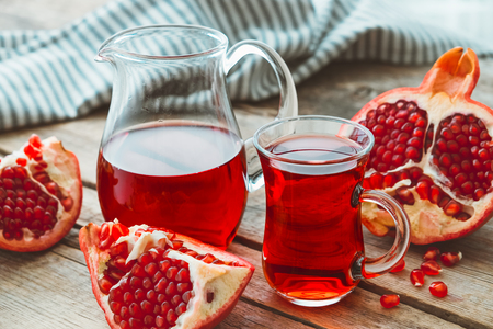 Pomegranate juice and pomegranate fruit.の写真素材