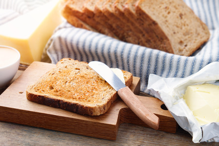 Toast bread slices, butter, and cheese for breakfast.の写真素材