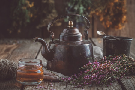 Vintage teapot, cup of healthy herbal teaの写真素材