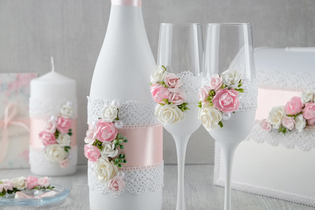Wedding set: bottle of champagne, glasses, candle, wedding album, invitations.の写真素材