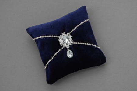 Wedding Pillow for Rings. Luxury velvet pillow decorated with jewelry.の写真素材