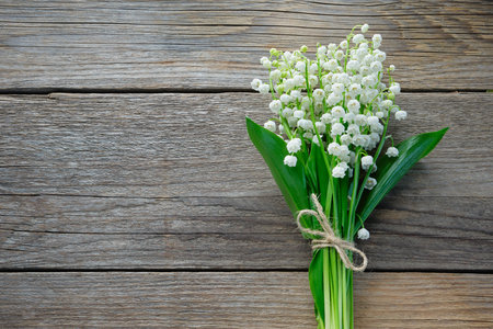 Lilies of the valley on woodenの写真素材