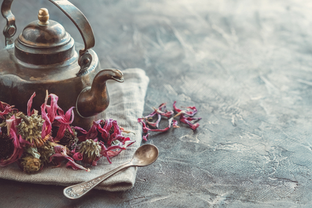 Vintage teapot of healthy echinacea tea and dry coneflower buds.の写真素材