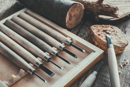 Woodworking tools for wood carving and trees cuts on wooden board.の写真素材