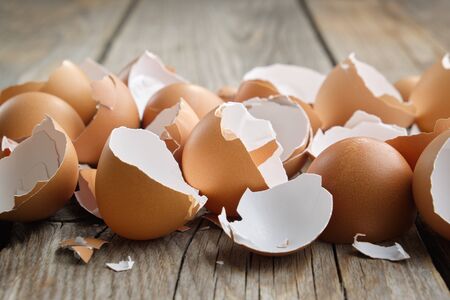 Eggshell  on wooden kitchen table.
