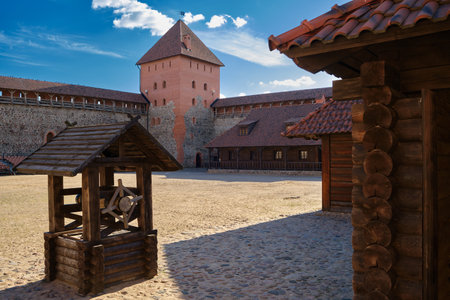 Old wooden well and tourist landmark attraction - Lida castle, Grodno region, Belarus.のeditorial素材