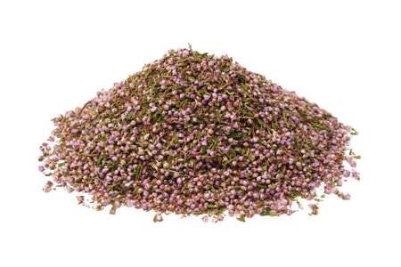 Pile of dried heather flowers pile. Dry Erica calluna petals heap on white. Alternative medicine.の写真素材