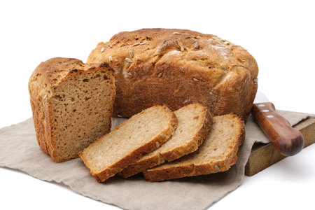Homemade bread. Traditional sourdough freshly baked bread and bread slice on white.の写真素材