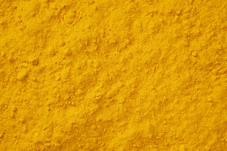 Turmeric spice background. Curcuma powder seasoning texture.の写真素材