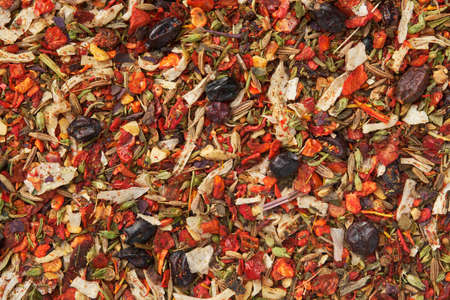 Background of spice mix for cooking oriental asian meals - plov, curry and others. Flakes of parsley, celery roots, tomatoes, red hot pepper, paprika, onion, barberry berries, cumin, saffron seasoningの写真素材